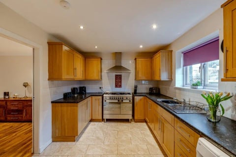 Kitchen with range cooker and tiled floor