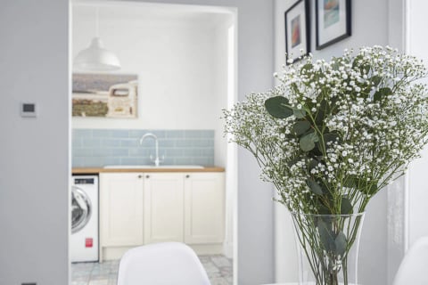 Sink with gypsophila and blue metro tiles