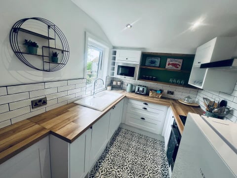 Compact galley kitchen with window over the sink