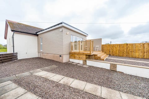 The extension and raised deck from the drive