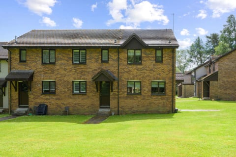 The brick terrace houses across the lawn