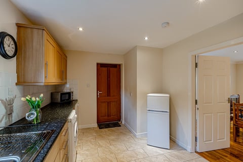 Utility corner with fridge-freezer and microwave